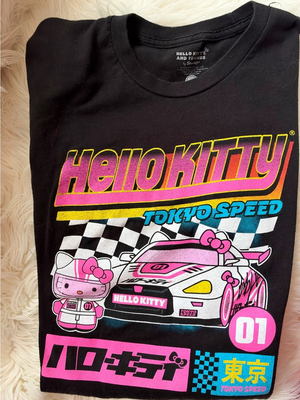 Sanrio Black Hello Kitty Racing Graphic Tee with Pink, Yellow & Blue